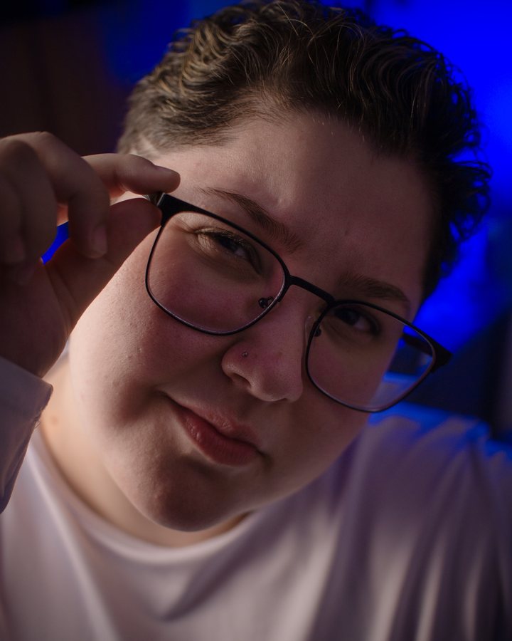 Kélita adjusting her glasses